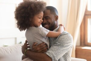 Father hugging daughter after getting her custody in Indianapolis