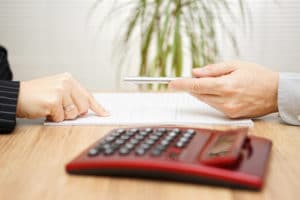 Woman Signing a legal document in Indianapolis
