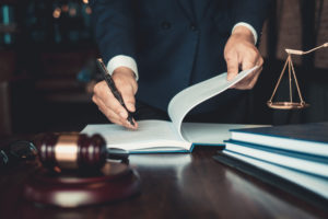A Lawyer signing a petition in Indianapolis, IN