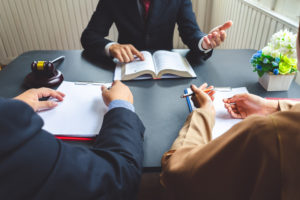 Couple working on a Divorce settlement with a Dixon & Moseley Lawyer